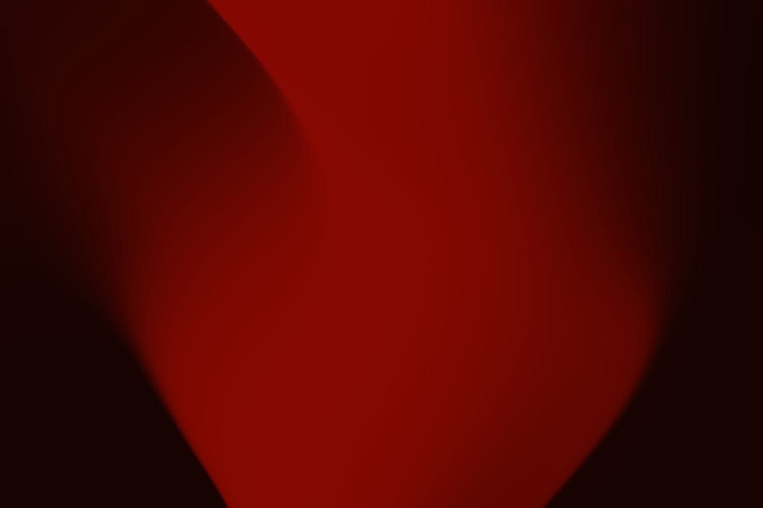 Abstract study in red: a single column of light rising through darkness.